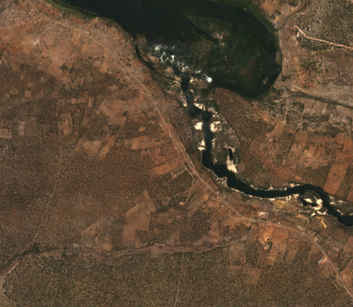 Animated satellite imagery of farm plots and a river near Sioma in 2020